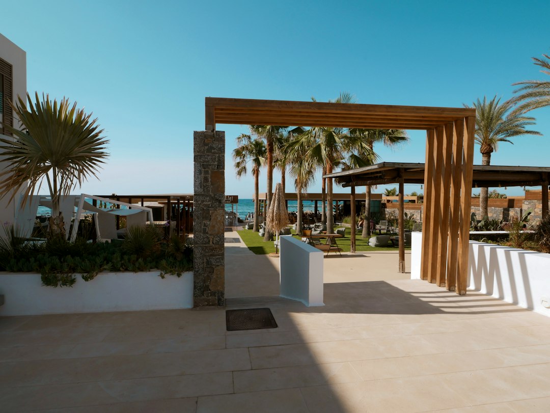 Seaside resort entrance with palm trees